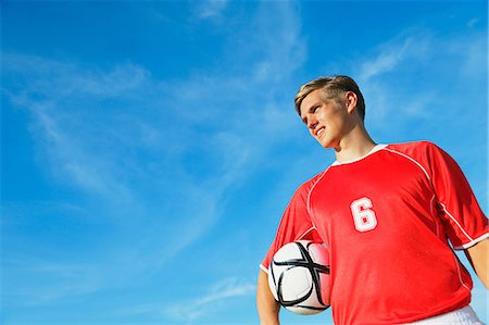 Soccer Player Standing With Ball Photographie de stock - Premium Libres de Droits, Code: 622-07736091