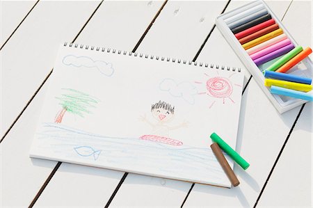 drawing sea - Crayons and drawing on white wooden flooring Stock Photo - Premium Royalty-Free, Code: 622-07743523