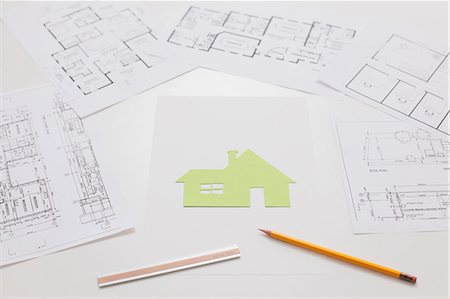 desk directly above - House construction drawings on white table Stock Photo - Premium Royalty-Free, Code: 622-07743539