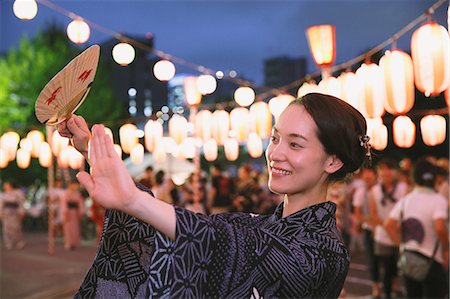 fan - Young Japanese woman in a traditional kimono at a summer festival Stock Photo - Premium Royalty-Free, Code: 622-07743573