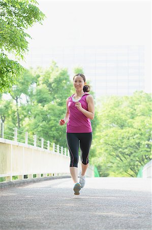 Young Japanese girl running in the park Stock Photo - Premium Royalty-Free, Code: 622-07760584