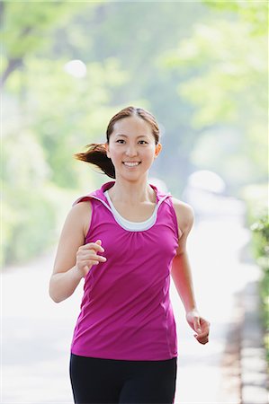 people jogging in the park - Young Japanese girl running in the park Stock Photo - Premium Royalty-Free, Code: 622-07760586