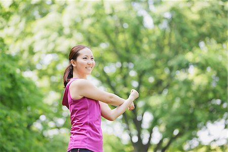 simsearch:622-07760681,k - Young Japanese girl stretching in the park Stock Photo - Premium Royalty-Free, Code: 622-07760589