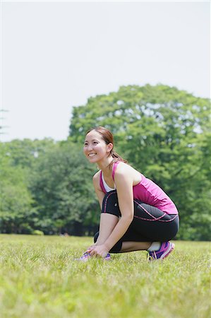 simsearch:622-07760681,k - Young Japanese girl stretching in the park Stock Photo - Premium Royalty-Free, Code: 622-07760607