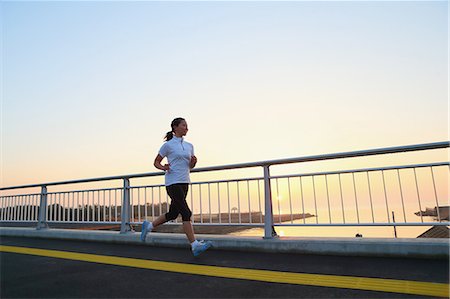 Young Japanese girl jogging Stock Photo - Premium Royalty-Free, Code: 622-07760677