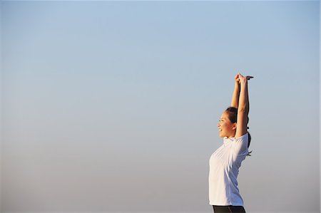 Young Japanese girl stretching Stock Photo - Premium Royalty-Free, Code: 622-07760689