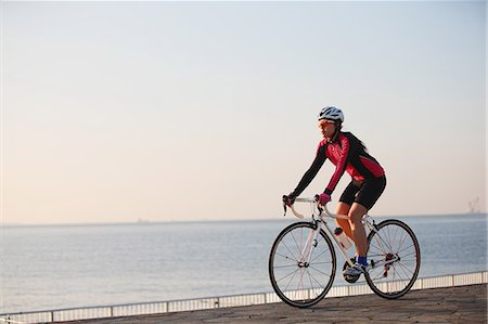 simsearch:859-06538343,k - Young Japanese girl cycling Stock Photo - Premium Royalty-Free, Code: 622-07760694