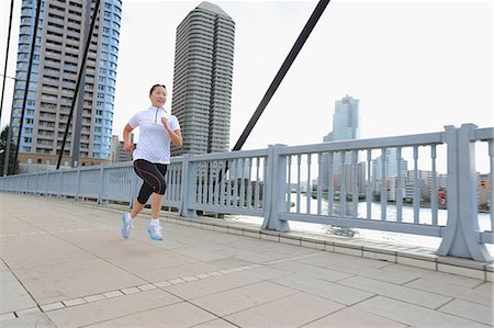 people at a mansion - Young Japanese girl jogging Stock Photo - Premium Royalty-Free, Code: 622-07760699