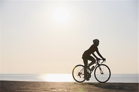 sunsets with trains - Young Japanese girl cycling Stock Photo - Premium Royalty-Free, Code: 622-07760693