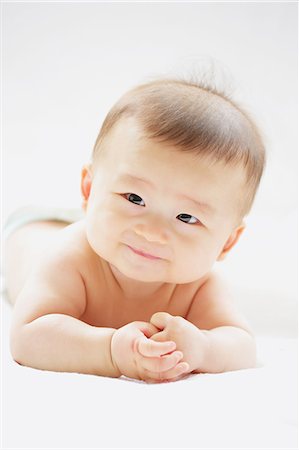 ethnic baby white background - Japanese newborn portrait Stock Photo - Premium Royalty-Free, Code: 622-08007289