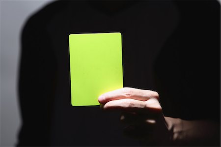 Man holding red card stock photo