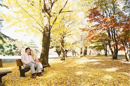 family pictures on a bench - Senior Japanese couple sitting on a bench in a city park Stock Photo - Premium Royalty-Free, Code: 622-08122783