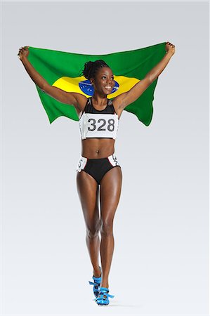 rio de janeiro olympics 2016 - Female Athlete Holding a Brazilian Flag Stock Photo - Premium Royalty-Free, Code: 622-08122836