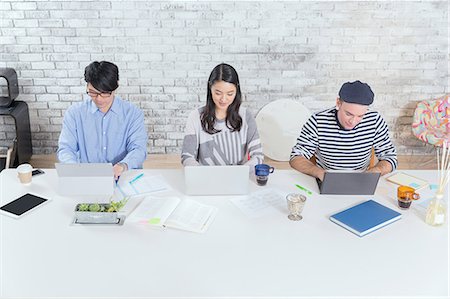 simsearch:622-08122972,k - Multi-ethnic business people working in modern office Stock Photo - Premium Royalty-Free, Code: 622-08123003