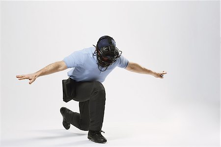 Baseball chief referee against white background Stock Photo - Premium Royalty-Free, Code: 622-08123167