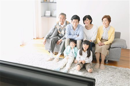 family watching tv together - Three-generation Japanese family on the sofa in the living room Stock Photo - Premium Royalty-Free, Code: 622-08123237