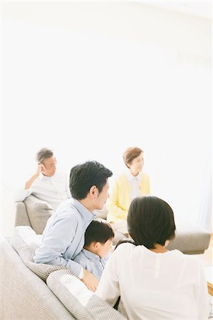 ethnic family watching tv - Three-generation Japanese family on the sofa in the living room Stock Photo - Premium Royalty-Free, Code: 622-08123257