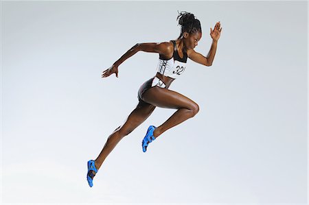 Female Athlete Running Stock Photo - Premium Royalty-Free, Code: 622-08123517