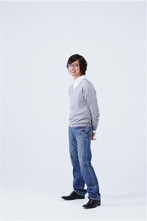 silhouette teen boy not woman not man not girl - Full body view of young man wearing jeans Stock Photo - Premium Royalty-Free, Code: 622-08139046