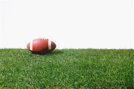 American football ball on grass Stock Photo - Premium Royalty-Free, Code: 622-08355407
