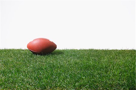 American football ball on grass Stock Photo - Premium Royalty-Free, Code: 622-08355408