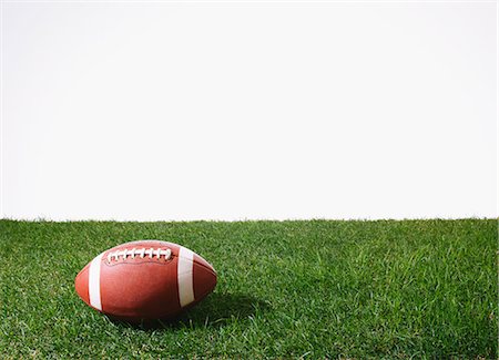 American football ball on grass Stock Photo - Premium Royalty-Free, Code: 622-08355414