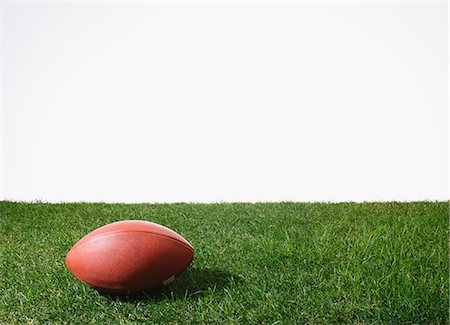 American football ball on grass Stock Photo - Premium Royalty-Free, Code: 622-08355415