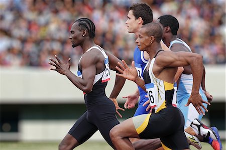 Athletes running on running track Stock Photo - Premium Royalty-Free, Code: 622-08355518