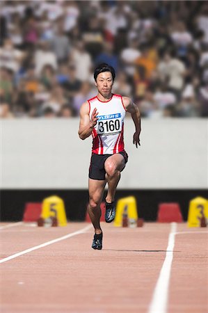 simsearch:622-08355542,k - Japanese male sprinter running on track Fotografie stock - Premium Royalty-Free, Codice: 622-08355534
