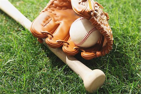 sports and baseball - Baseball equipment on grass Stock Photo - Premium Royalty-Free, Code: 622-08355574