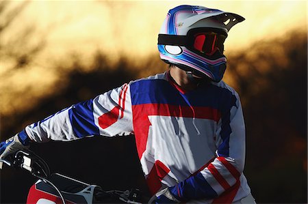 Motocross biker on dirt track Stock Photo - Premium Royalty-Free, Code: 622-08355582