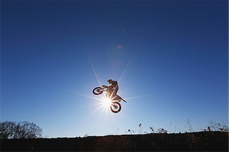 Motocross biker on dirt track Stock Photo - Premium Royalty-Free, Code: 622-08355596