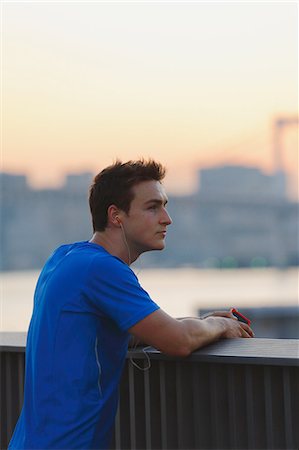 Young Caucasian man wearing sport clothes in metropolitan area Stock Photo - Premium Royalty-Free, Code: 622-08355647