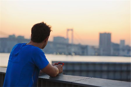 Young Caucasian man wearing sport clothes in metropolitan area Stock Photo - Premium Royalty-Free, Code: 622-08355648