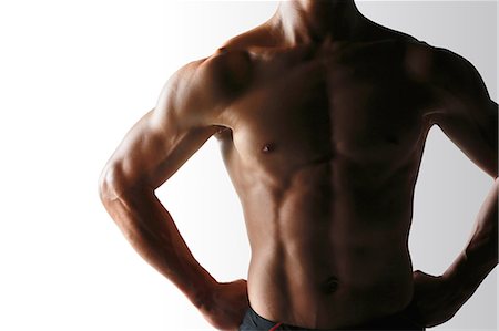 simsearch:622-08355441,k - Japanese male athlete showing off muscles Photographie de stock - Premium Libres de Droits, Code: 622-08355749