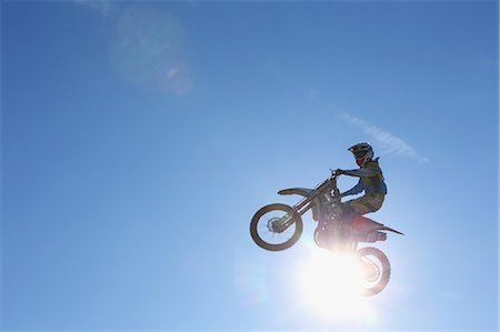 Motocross biker jumping over dirt track Stock Photo - Premium Royalty-Free, Code: 622-08355866
