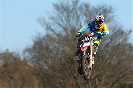 Motocross biker on dirt track Stock Photo - Premium Royalty-Free, Code: 622-08355862