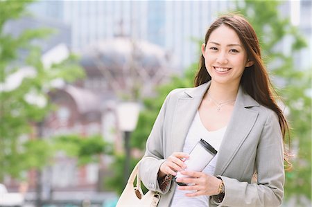 Japanese attractive businesswoman in downtown Tokyo Stock Photo - Premium Royalty-Free, Code: 622-08482375