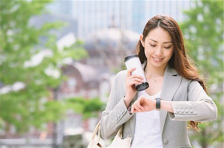 Japanese attractive businesswoman in downtown Tokyo Stock Photo - Premium Royalty-Free, Code: 622-08482376