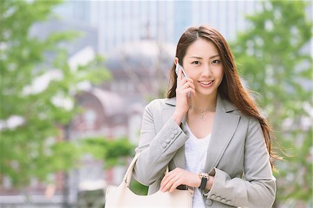 Japanese attractive businesswoman in downtown Tokyo Stock Photo - Premium Royalty-Free, Code: 622-08482377