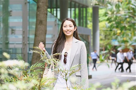 Japanese attractive businesswoman in downtown Tokyo Stock Photo - Premium Royalty-Free, Code: 622-08482373