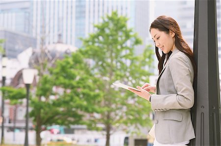 Japanese attractive businesswoman in downtown Tokyo Stock Photo - Premium Royalty-Free, Code: 622-08482384