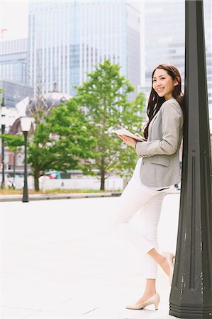 Japanese attractive businesswoman in downtown Tokyo Stock Photo - Premium Royalty-Free, Code: 622-08482385