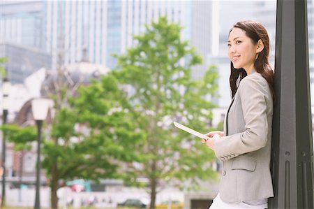 Japanese attractive businesswoman in downtown Tokyo Stock Photo - Premium Royalty-Free, Code: 622-08482383