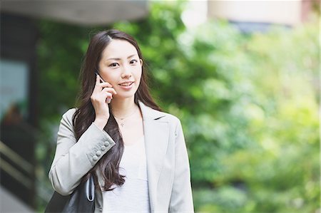 Japanese attractive businesswoman in downtown Tokyo Stock Photo - Premium Royalty-Free, Code: 622-08482397