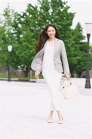 Japanese attractive businesswoman in downtown Tokyo Stock Photo - Premium Royalty-Free, Code: 622-08482390