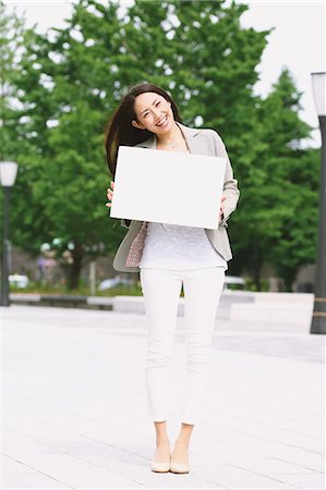 Japanese attractive businesswoman in downtown Tokyo Stock Photo - Premium Royalty-Free, Code: 622-08482392