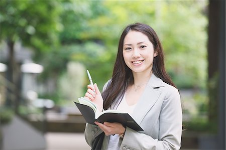 Japanese attractive businesswoman in downtown Tokyo Stock Photo - Premium Royalty-Free, Code: 622-08482403