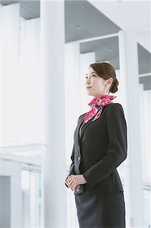 Japanese attractive flight attendant at the airport Photographie de stock - Premium Libres de Droits, Code: 622-08482468