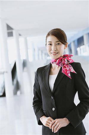 Japanese attractive flight attendant at the airport Stock Photo - Premium Royalty-Free, Code: 622-08482496
